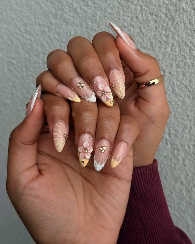 1. Gold Accent Floral Almond Nails - flower nail ideas
