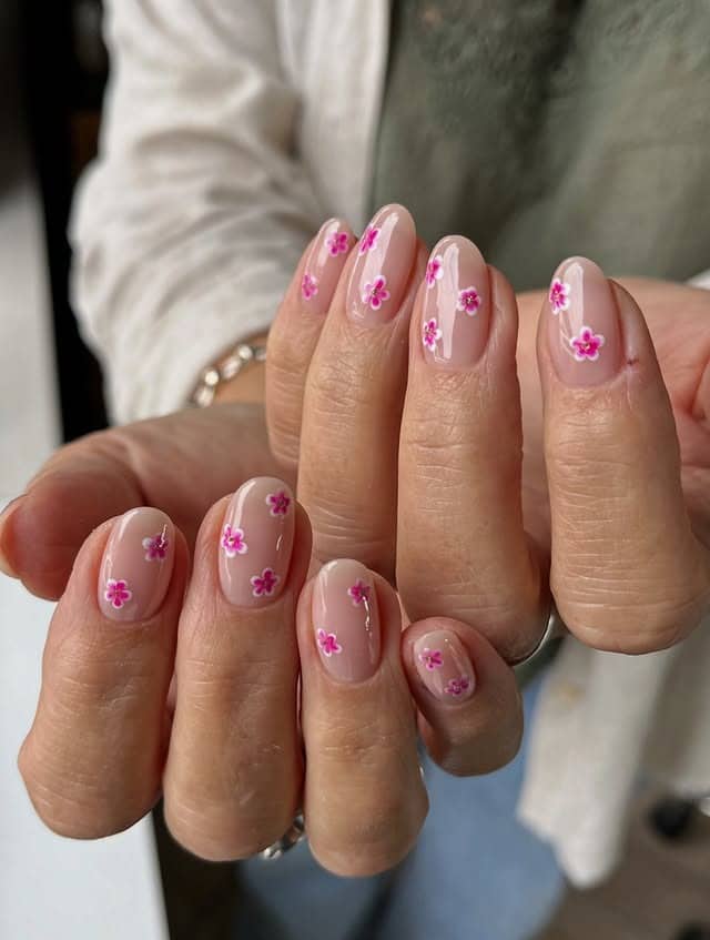 2. Minimal Pink Daisy Short Nails - flower nail ideas