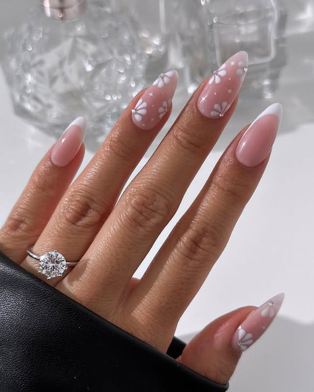 4. Soft Pink Daisy French Almond Nails - flower nail ideas