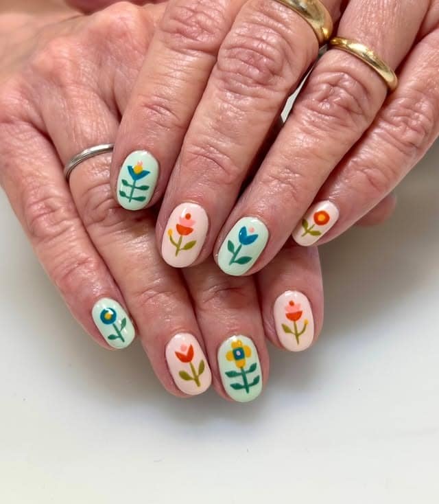 14. Retro Floral Short Oval Nails - flower nail ideas