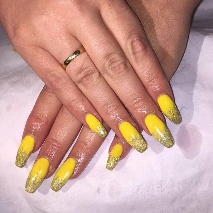 2. Lemon Yellow Glitter Fade Coffin Nails - yellow coffin nail ideas