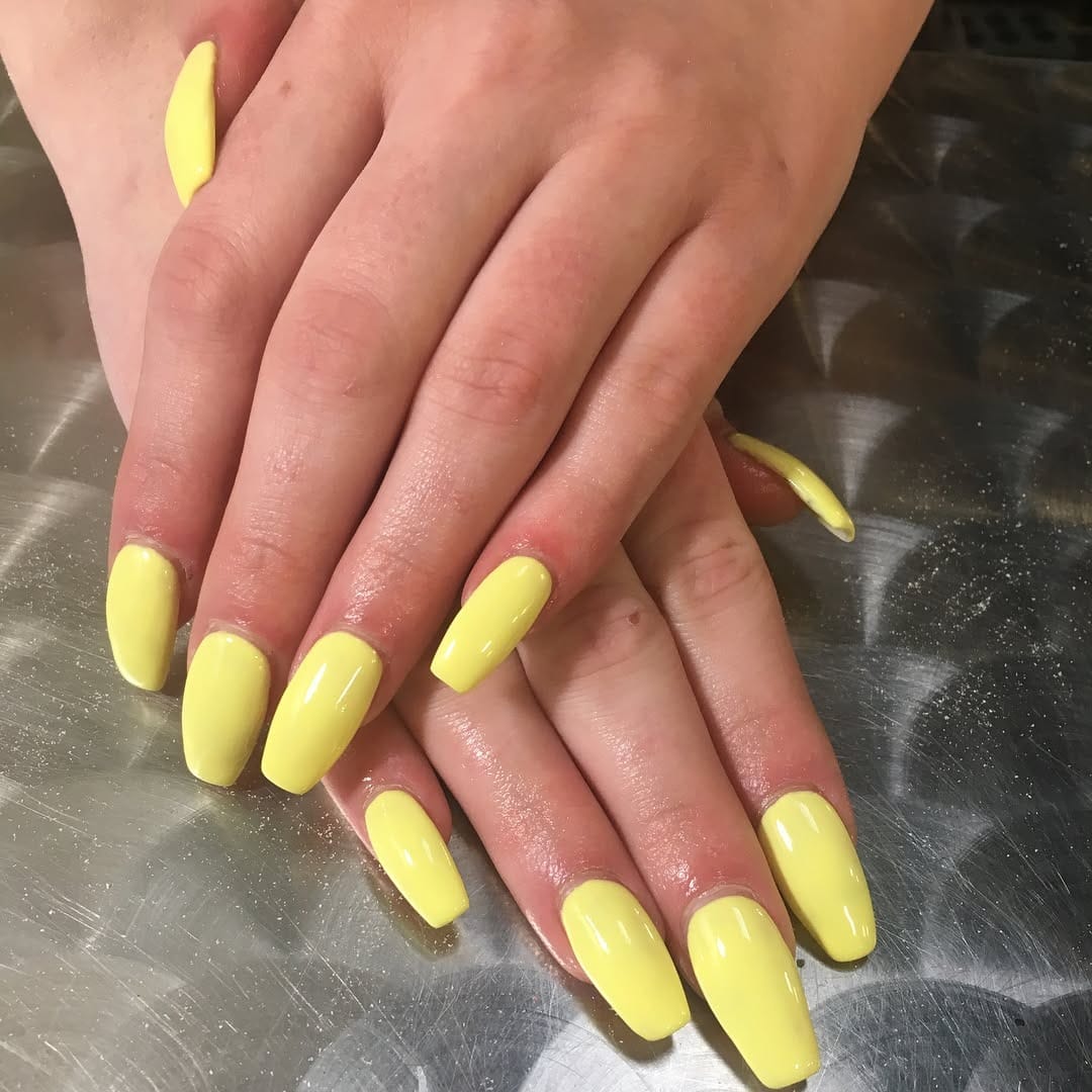 13. Butter Yellow Glossy Coffin Nails - yellow coffin nail ideas