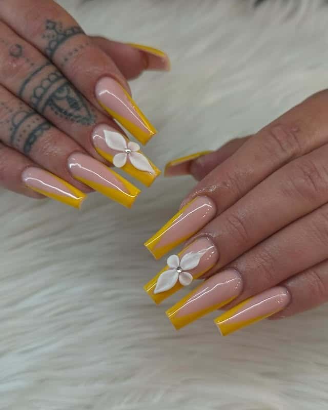17. Yellow French Tip Coffin Nails with White Flower Accents - yellow coffin nail ideas