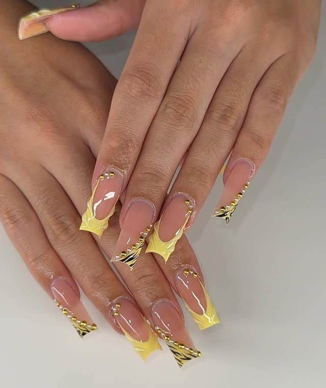 22. Pastel Yellow French Coffin Nails with Gold Chrome Accents - yellow coffin nail ideas