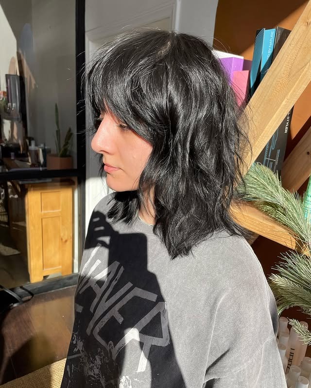 6. Shaggy Collarbone Cut with Jet Black Finish - Short Wispy Haircuts