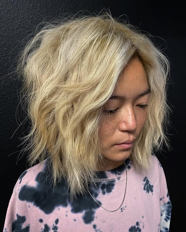 9. Tousled Platinum Blonde Bob with Choppy Layers - Short Wispy Haircuts