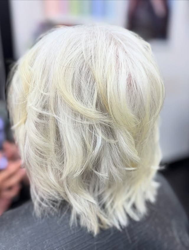13. Wispy Platinum Layered Crop - Short Wispy Haircuts