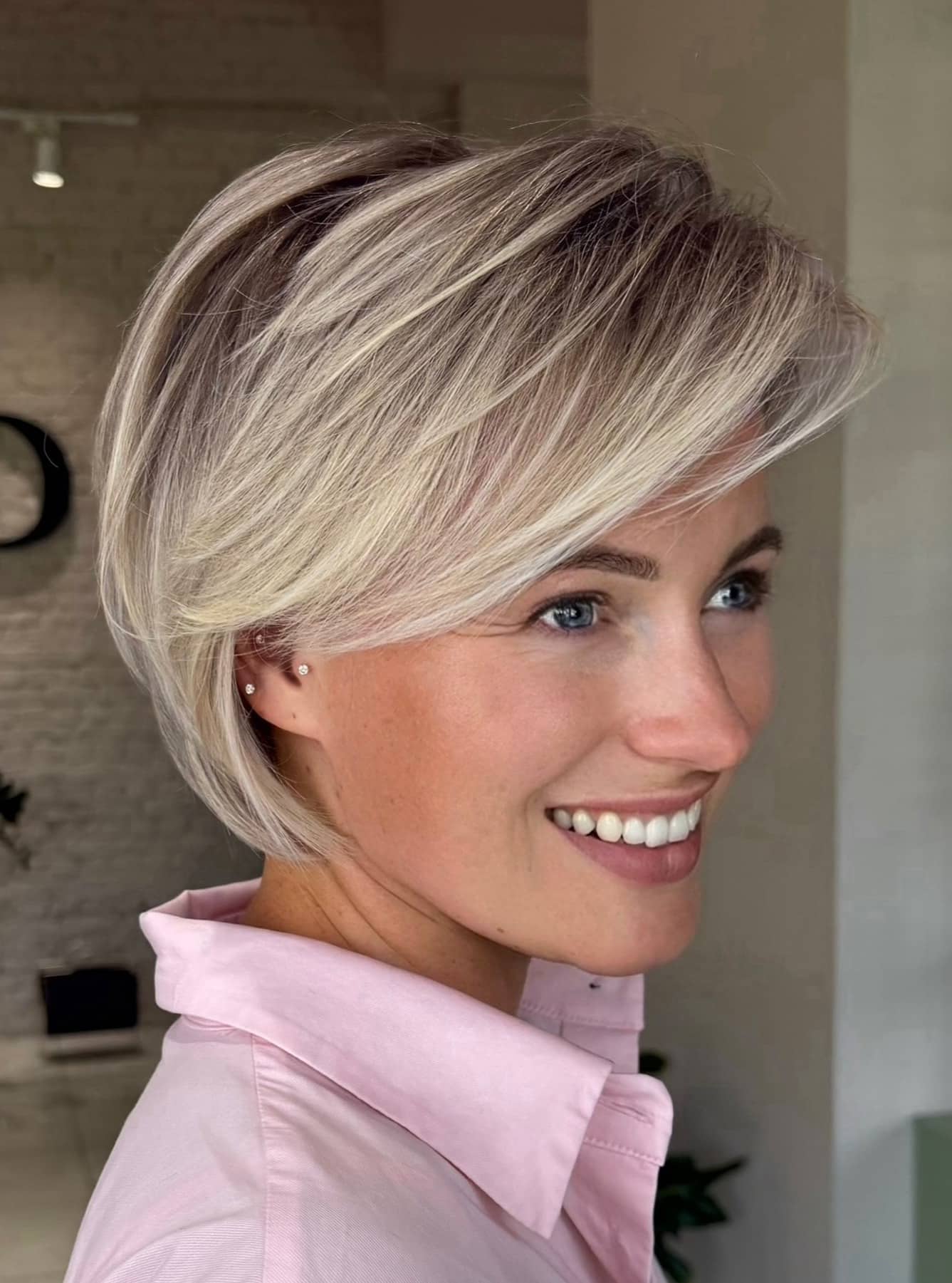 17. Side-Swept Blonde Pixie Bob with Ash Highlights - Short Wispy Haircuts