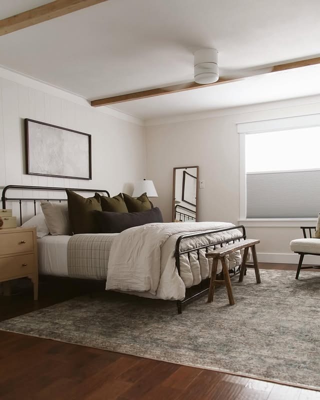9. Modern Farmhouse Bedroom with Black Iron Bed Frame - earthy bedroom ideas