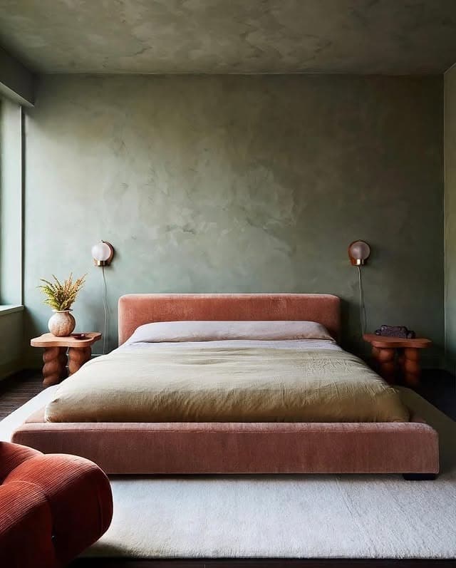 21. Moody Olive Green Bedroom with Clay-Tone Upholstered Bed - earthy bedroom ideas