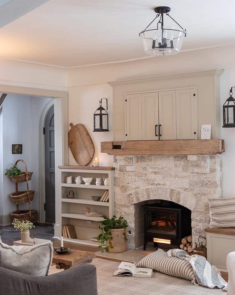 2. Rustic Cream Cottage Living Room with Stone Fireplace - cottage living room ideas