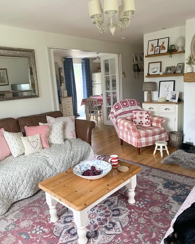 6. Cozy Cottage Living Room with Pink and Red Accents - cottage living room ideas