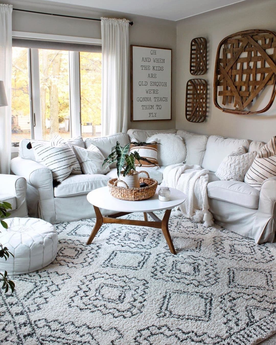 8. White Cottage Living Room with Black and Natural Accents - cottage living room ideas