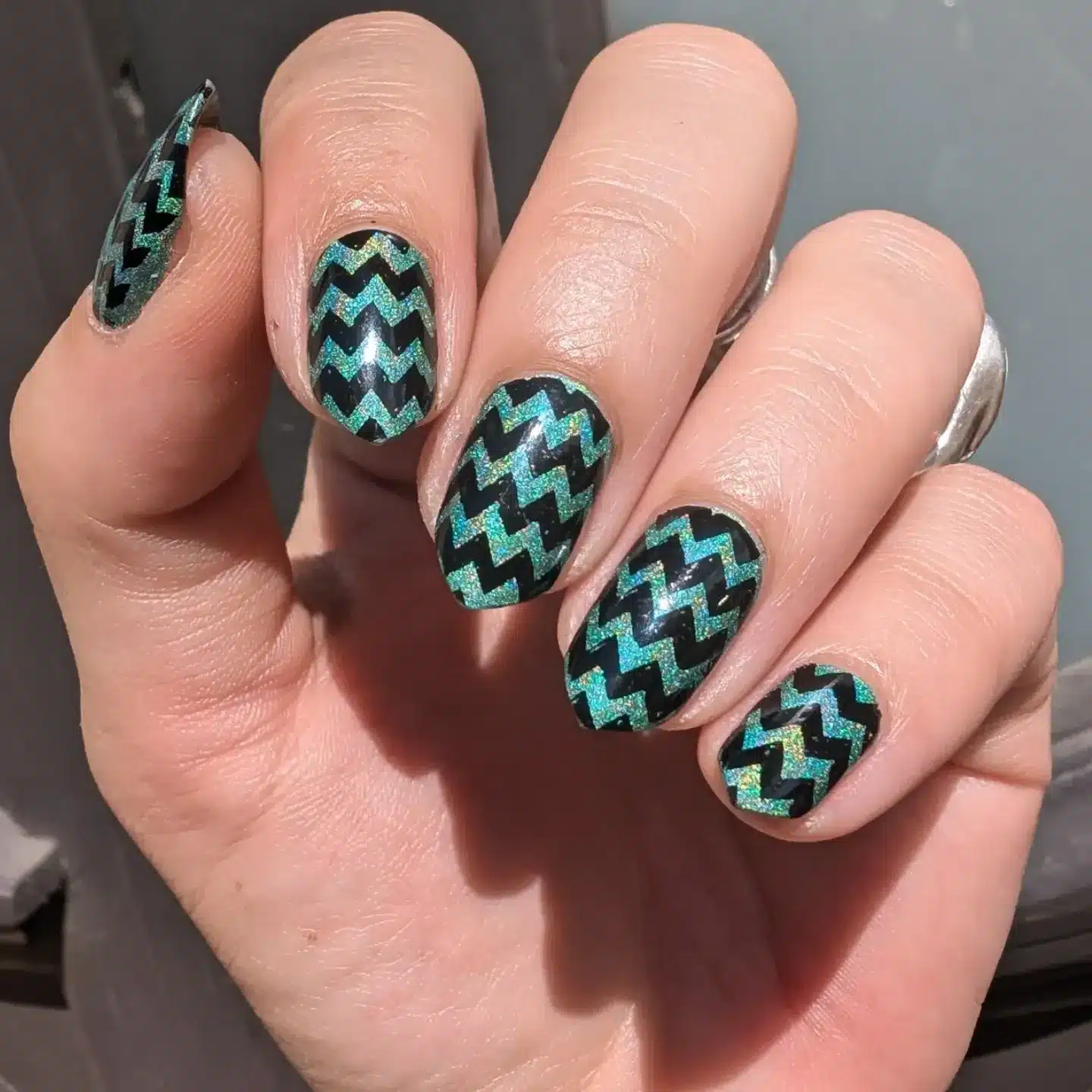 17. Black and Teal Holographic Zig Zag Nails - zig zag nail ideas