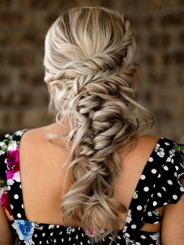 16. Platinum Blonde Loose Fishtail Updo - Fishtail Braid Hairstyles