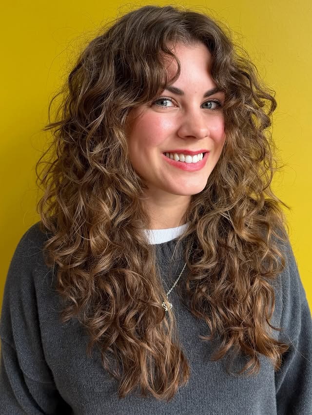 1. Long Layered Curly Cut with Chestnut Brown Balayage - Wispy Bangs For Curly Hair