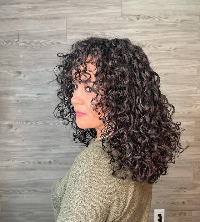 5. Rounded Curly Bob with Natural Dark Brunette Color - Wispy Bangs For Curly Hair