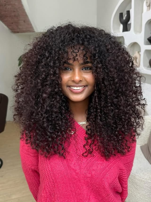 10. Voluminous Coily Layers with Deep Espresso Color - Wispy Bangs For Curly Hair