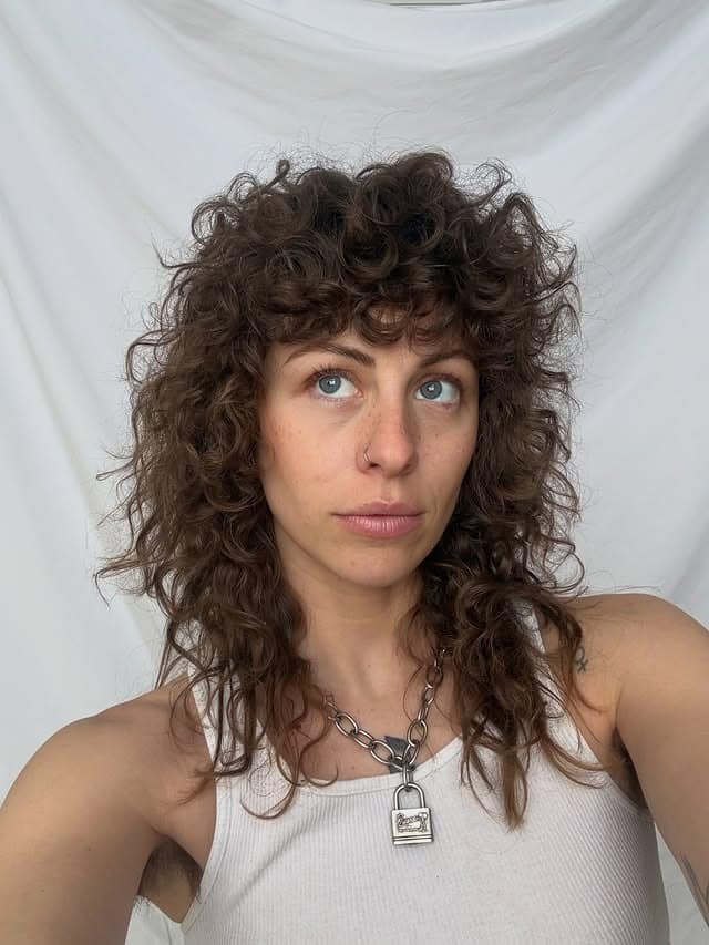 13. Curly Shag Mullet with Rich Medium Brown Color - Wispy Bangs For Curly Hair