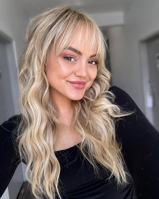 18. Long Wavy Layers with Creamy Platinum Blonde Color - Wispy Bangs For Curly Hair