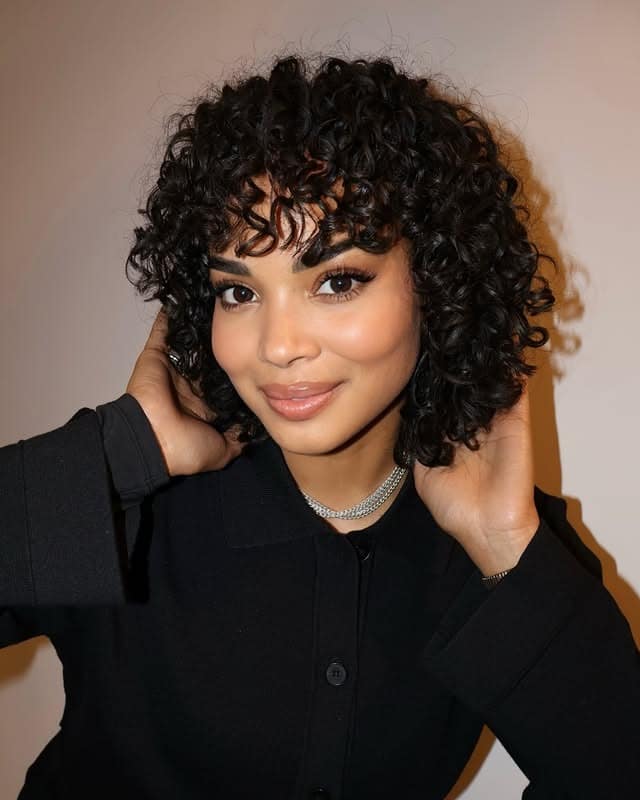 19. Curly Bob with Jet Black Ringlets - Wispy Bangs For Curly Hair