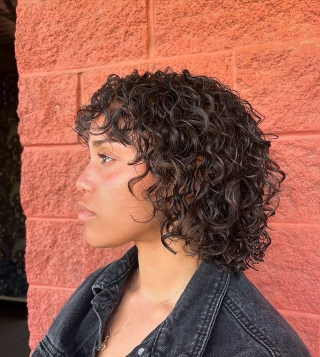 22. Short Curly Shag Bob with Deep Espresso Brown Color - Wispy Bangs For Curly Hair
