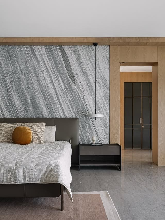 10. Contemporary Grey Marble Bedroom with Black Furniture Details - white, grey and black bedroom ideas