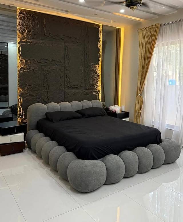 11. Sculptural Grey and Black Bedroom with Statement Bed Design - white, grey and black bedroom ideas