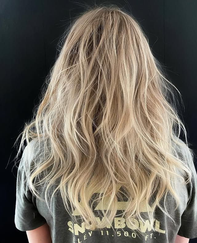 9. Icy Champagne Blonde Tousled Layers - Long Textured Layers