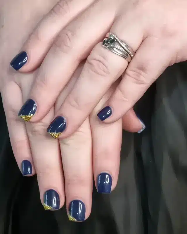 4. Navy Blue Glitter French Tip Nails - navy and gold nail ideas