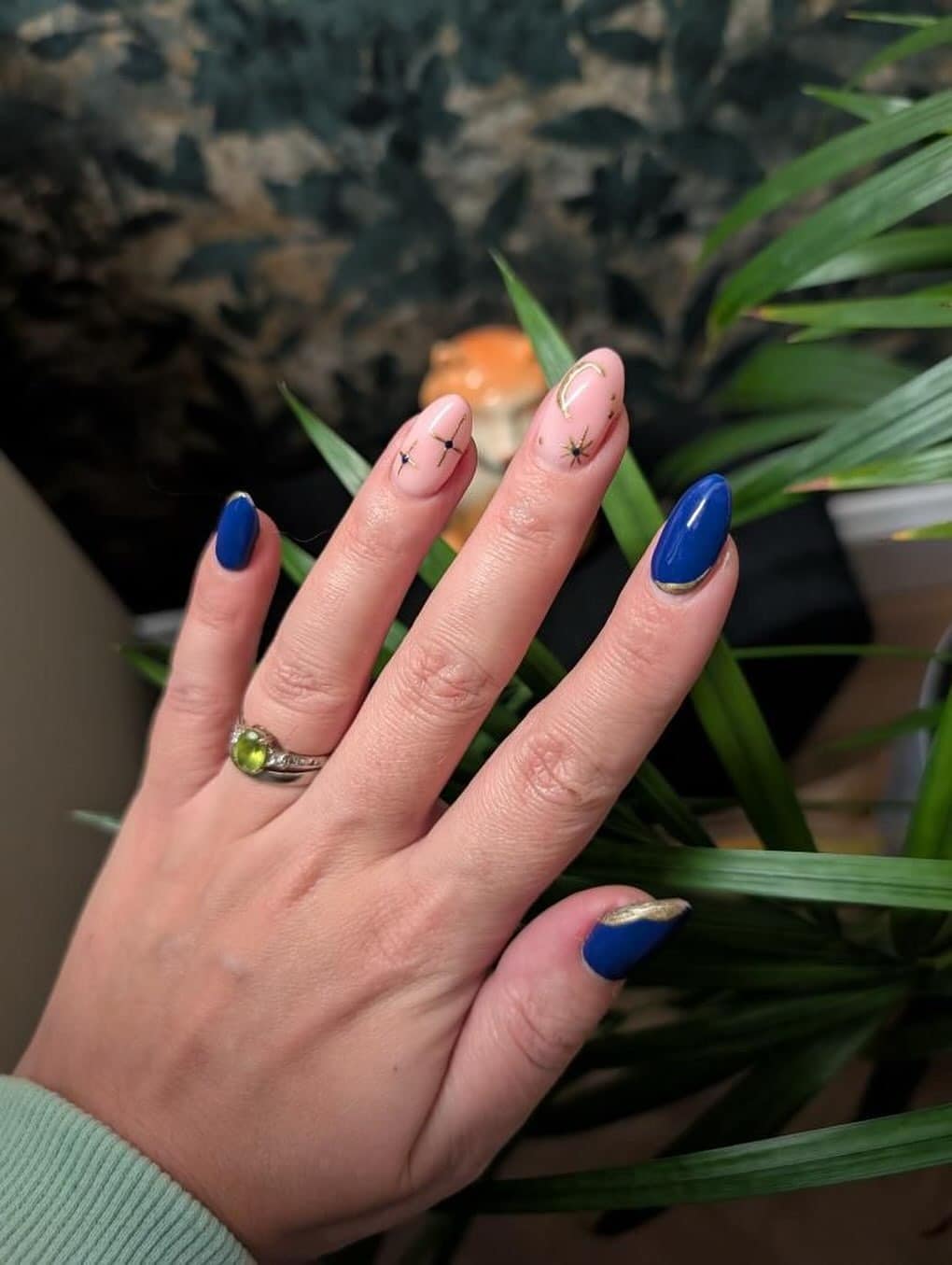 5. Blue and Gold Celestial Almond Nails - navy and gold nail ideas