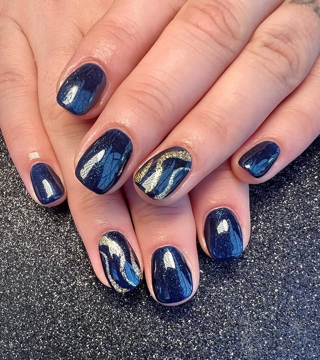 9. Midnight Navy Swirl Accent Nails - navy and gold nail ideas