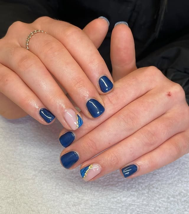 10. Dusty Navy and Gold Marble Nails - navy and gold nail ideas