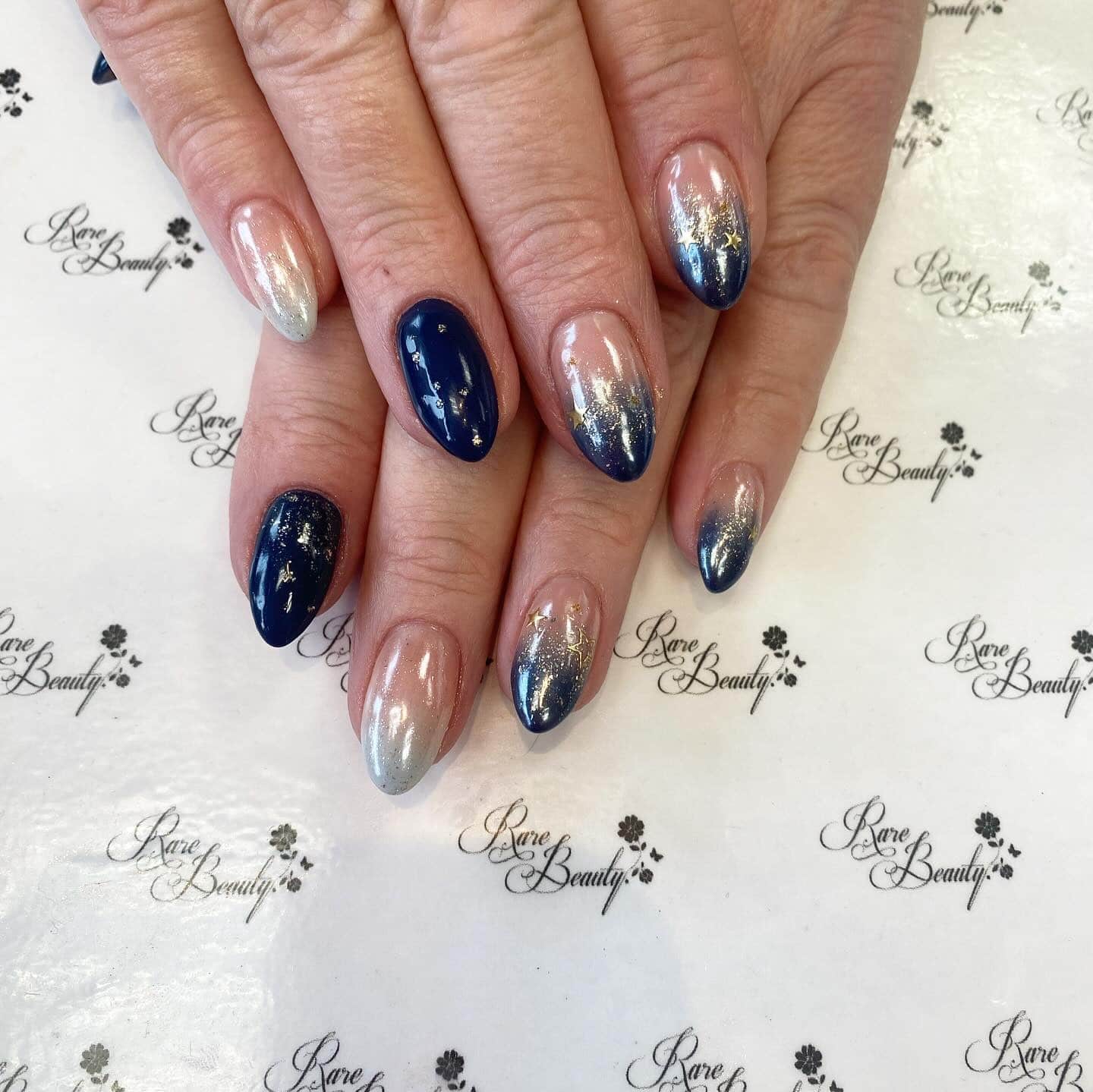 13. Navy Ombre Chrome Almond Nails - navy and gold nail ideas