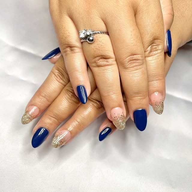 16. Royal Blue and Gold Glitter Accent Nails - navy and gold nail ideas