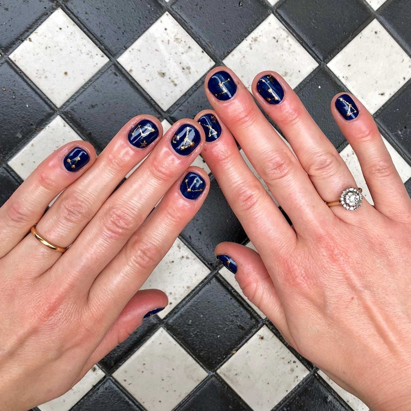 18. Midnight Blue Gold Cross Nails - navy and gold nail ideas