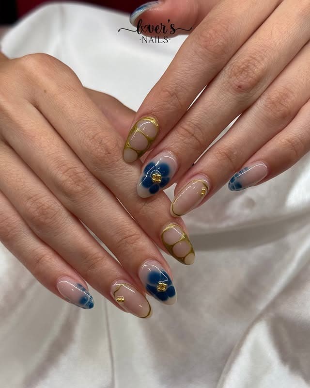19. Blue Floral Gold Outline Nails - navy and gold nail ideas