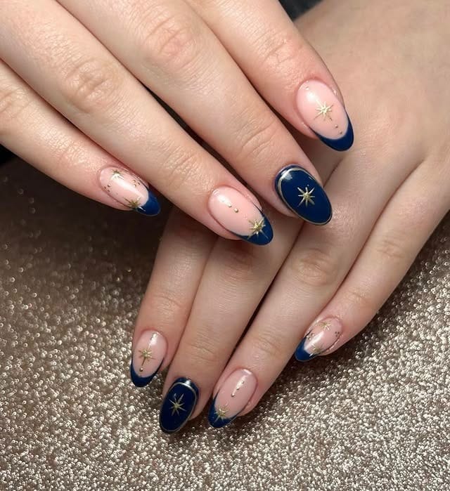 22. Navy French Starburst Almond Nails - navy and gold nail ideas