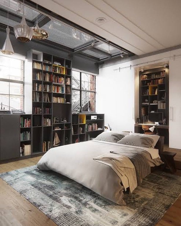 14. Loft-Style Industrial Bedroom with Library Wall - industrial bedroom ideas