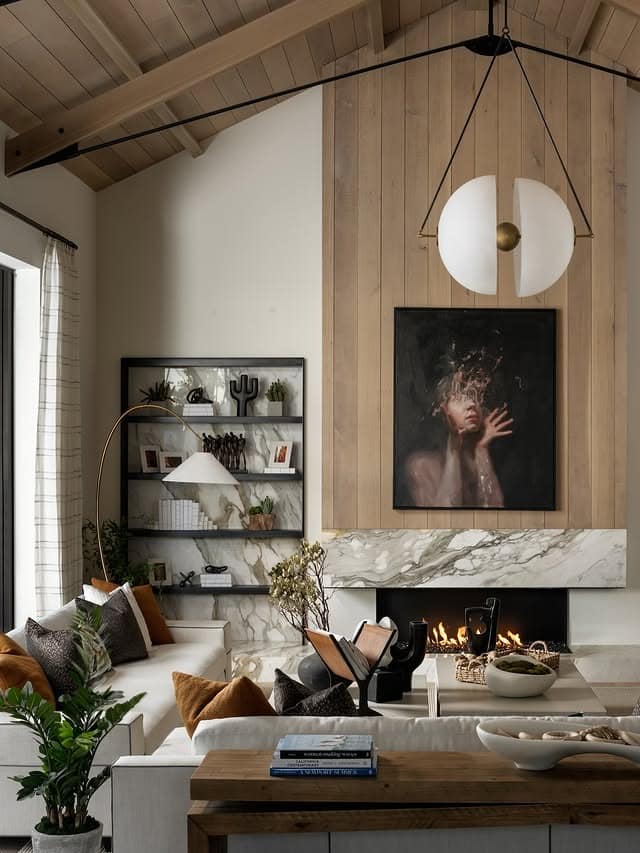 1. Warm Wood and Marble Moody Living Room - moody living room ideas