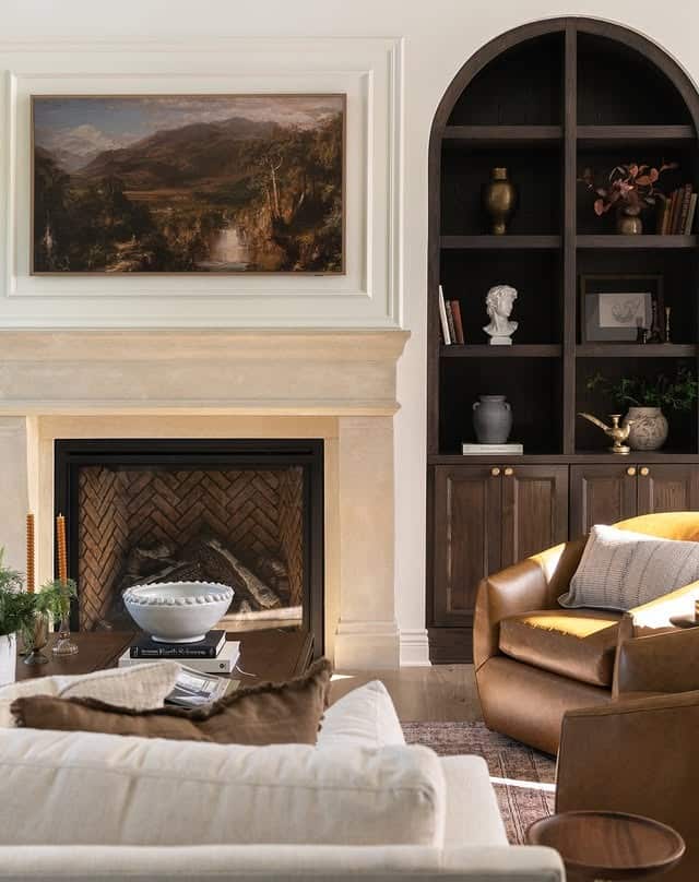 8. Classic Fireplace Living Room with Dark Built-Ins - moody living room ideas