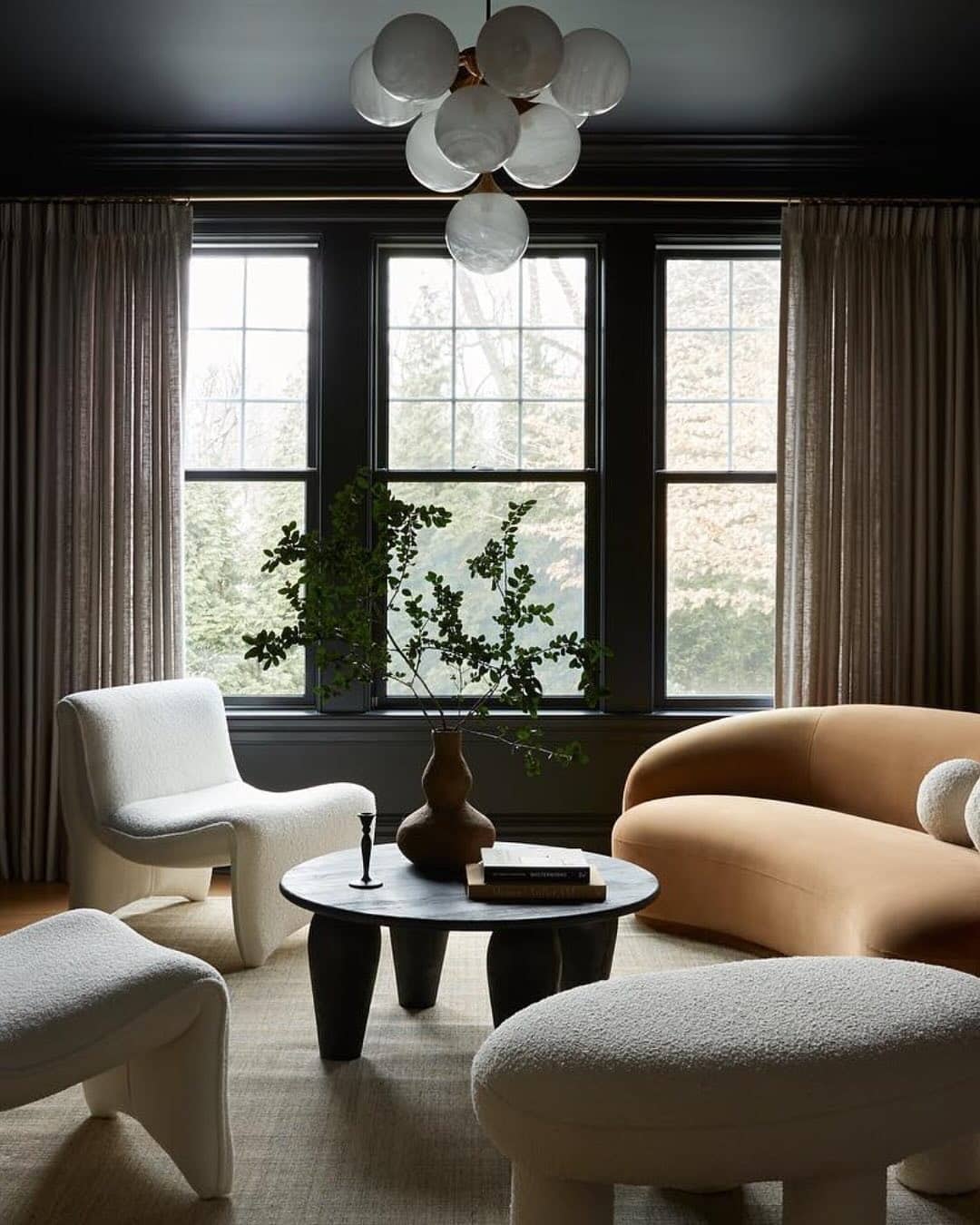 9. Modern Moody Living Room with Curved Seating - moody living room ideas