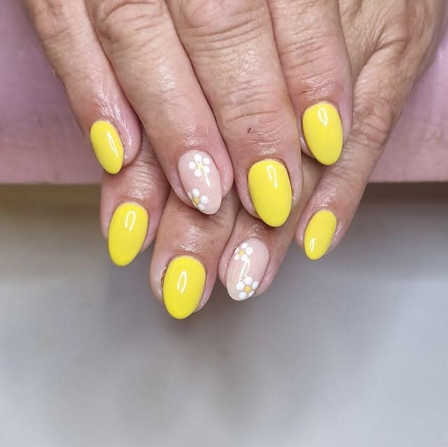 10. Yellow Almond Nails with White Flower Accents - yellow and white nail ideas