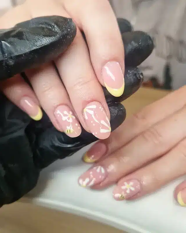 14. Soft Yellow Floral French Tip Nails - yellow and white nail ideas
