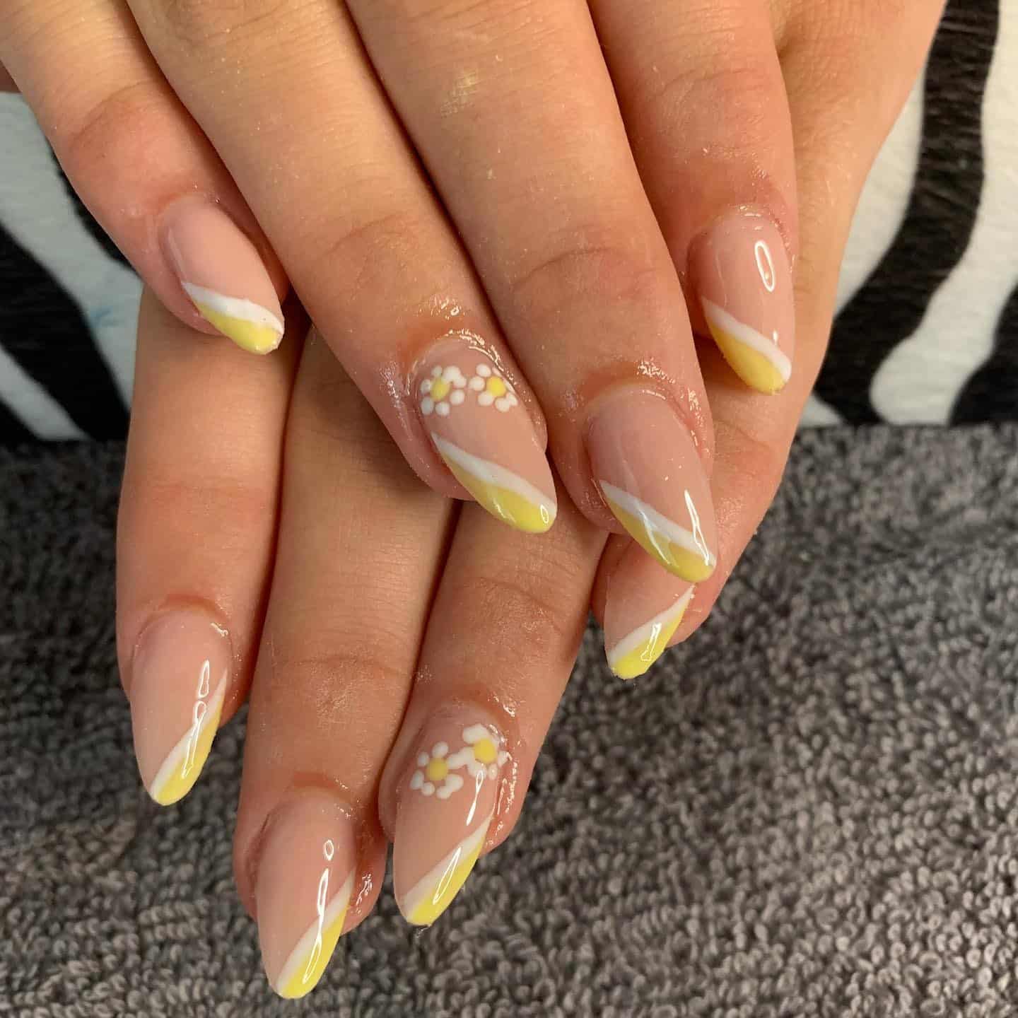 17. Diagonal Yellow French Tip Nails - yellow and white nail ideas