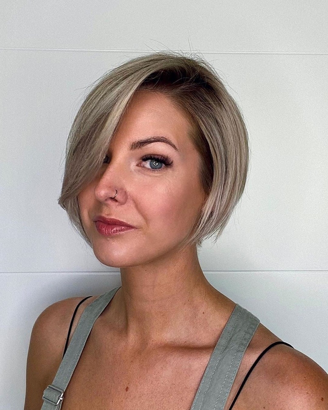 6. Smoky Beige Blonde Side-Swept Pixie - Long Pixie Haircuts