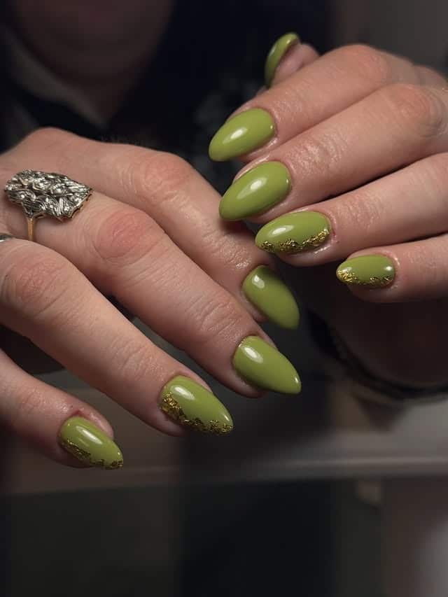 1. Olive Green Almond Nails with Gold Foil Tips - green nail ideas