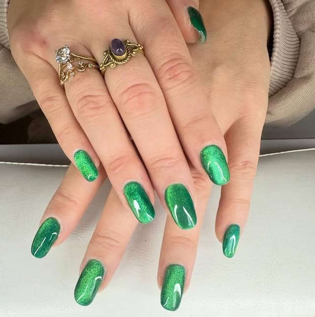 4. Sparkling Green Cat Eye Nails - green nail ideas
