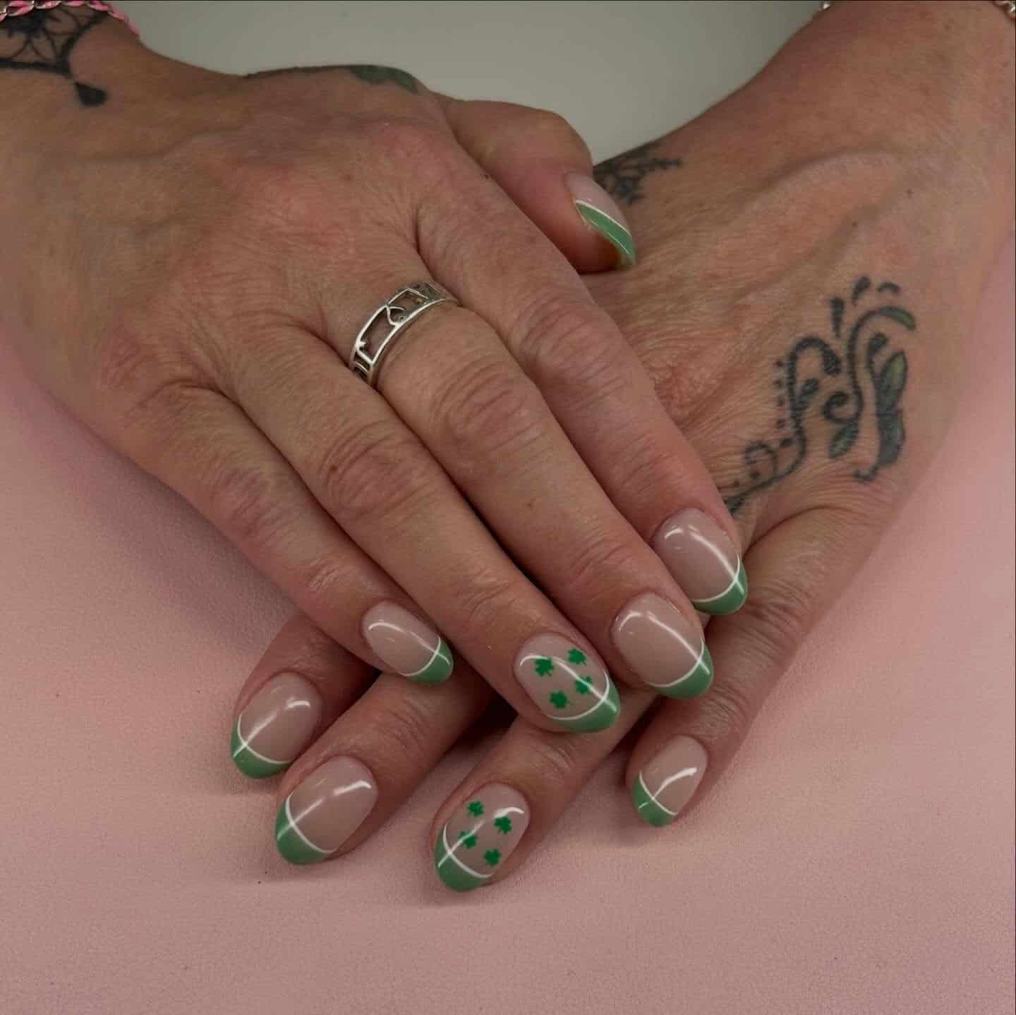 17. Mint Green Clover French Tip Nails - green nail ideas