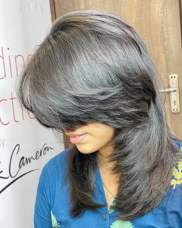 3. Face-Framing Feather Cut with Smoky Black Tones - Feather Haircuts For Women